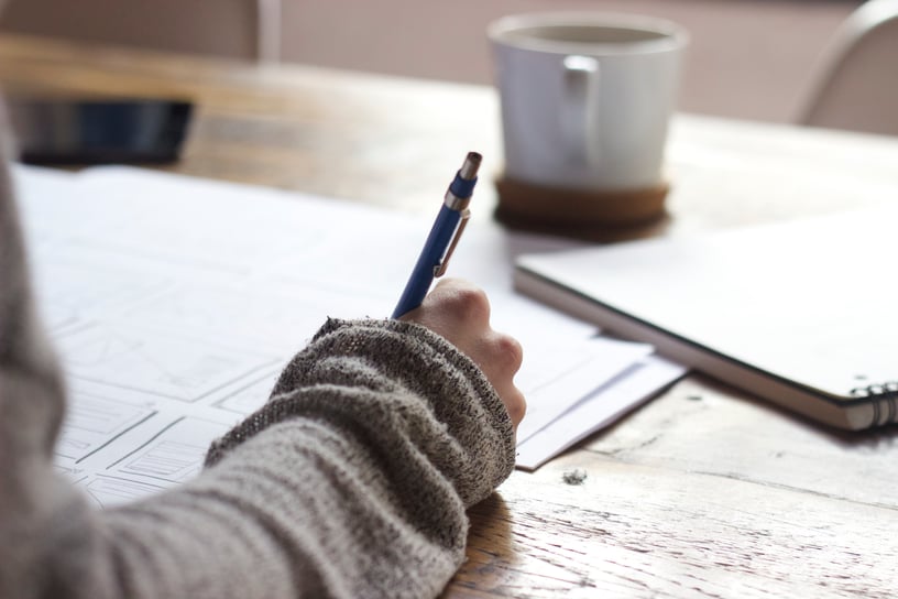 Hands-Writing-Desk-Papers.jpeg